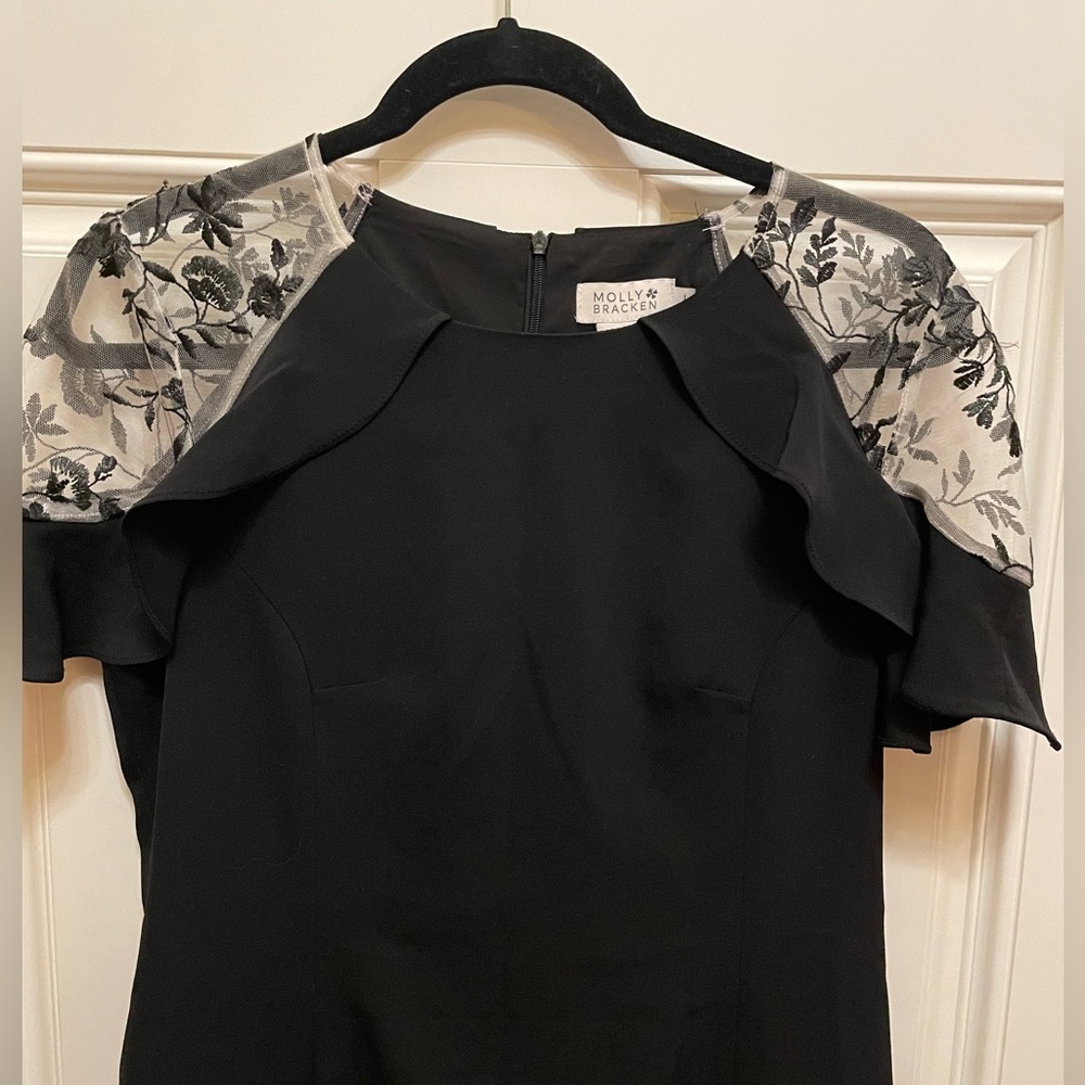 Size Large Molly Bracken black dress with black leaves on the shoulder area